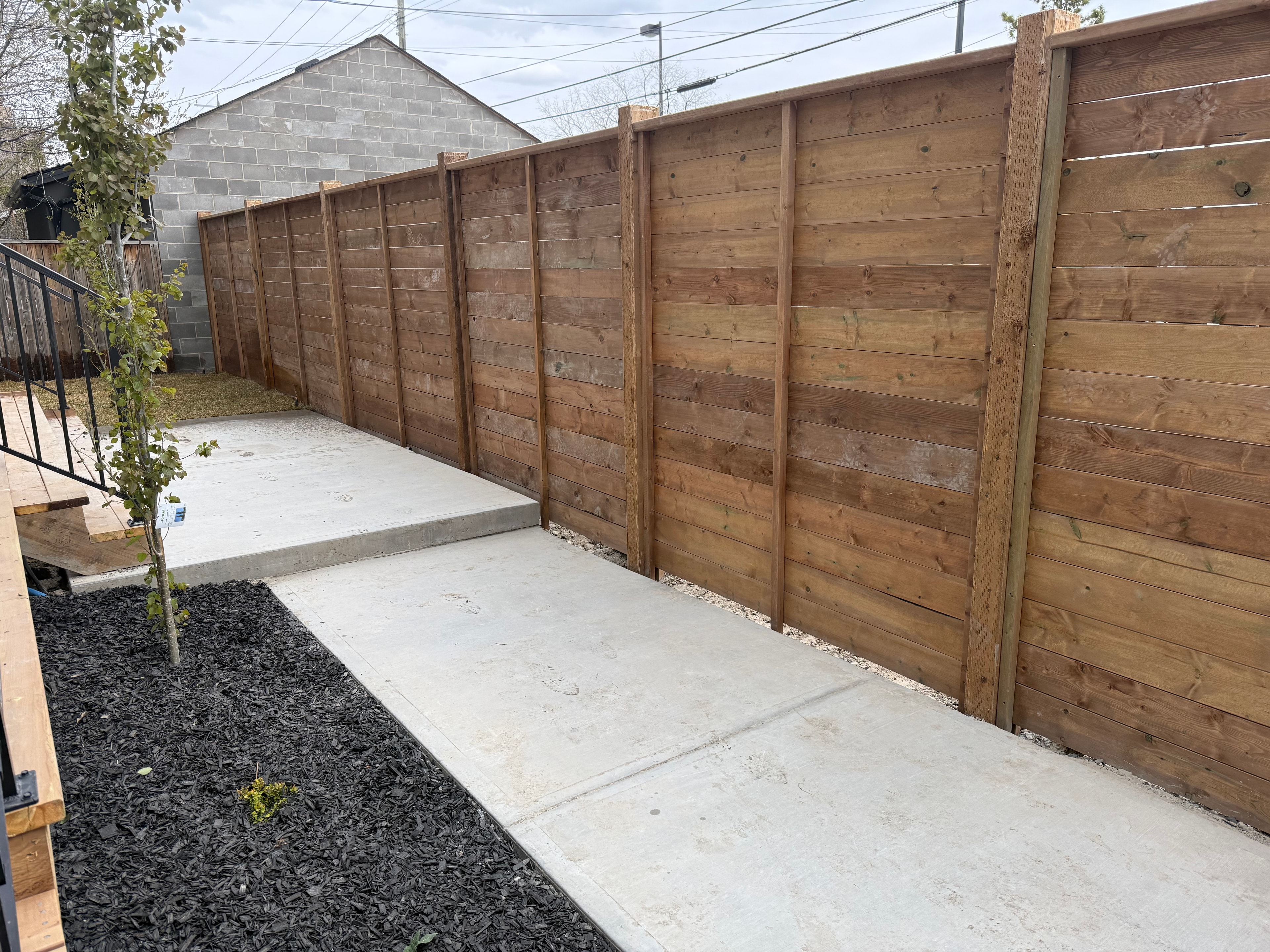Wooden fence installation by Tri-Star